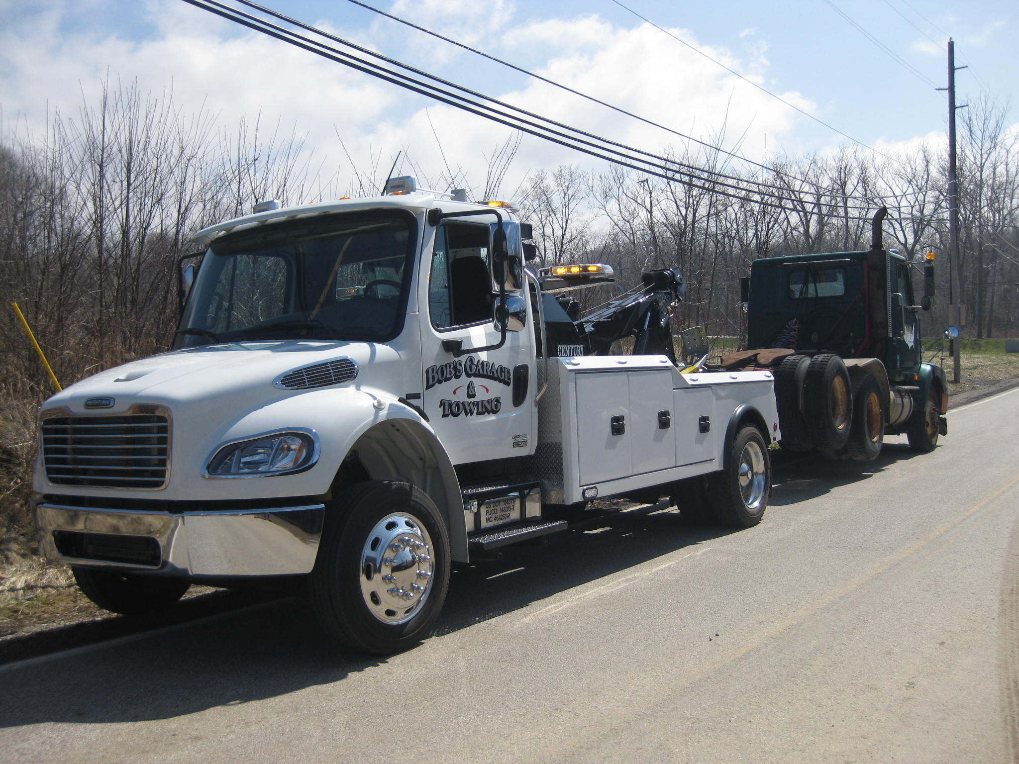 Our 16 ton wrecker towing a tandem axle tractor